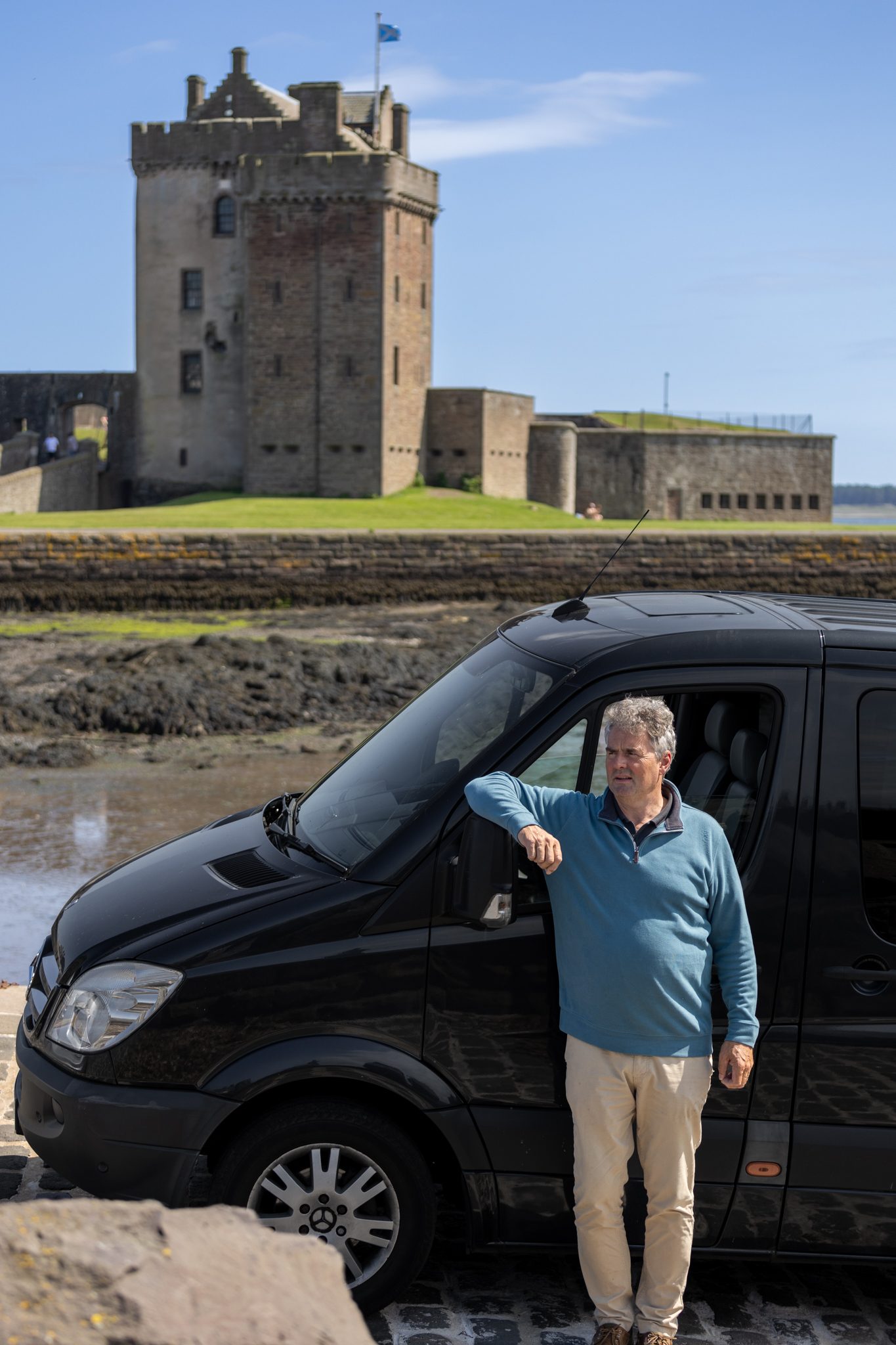Stag Elite Tours guide and Mercedes Sprinter at Broughty Castle